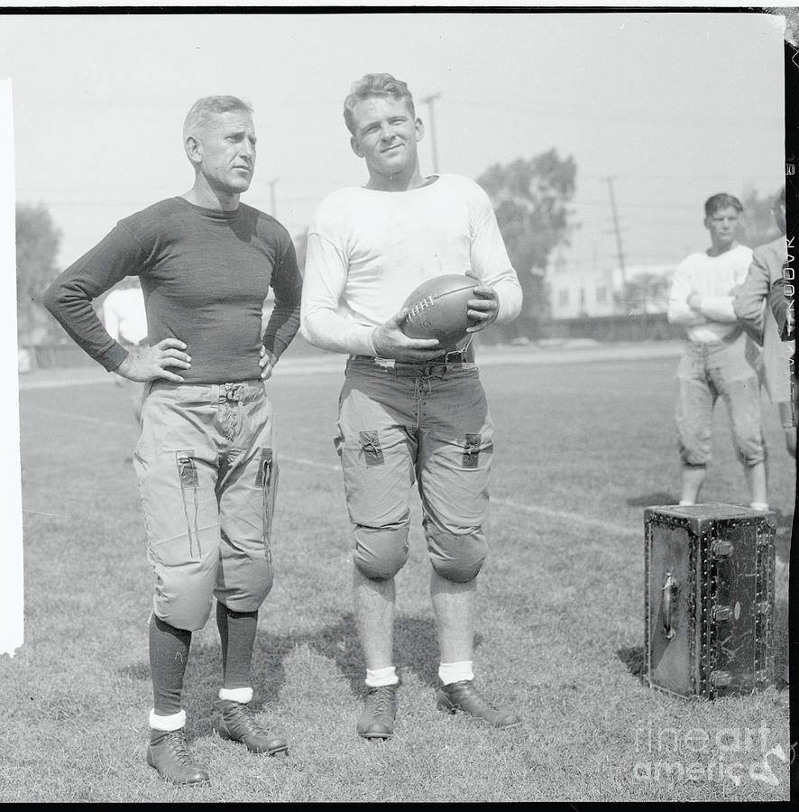 Football Coach With One Of His Teammates Photograph by Bettmann