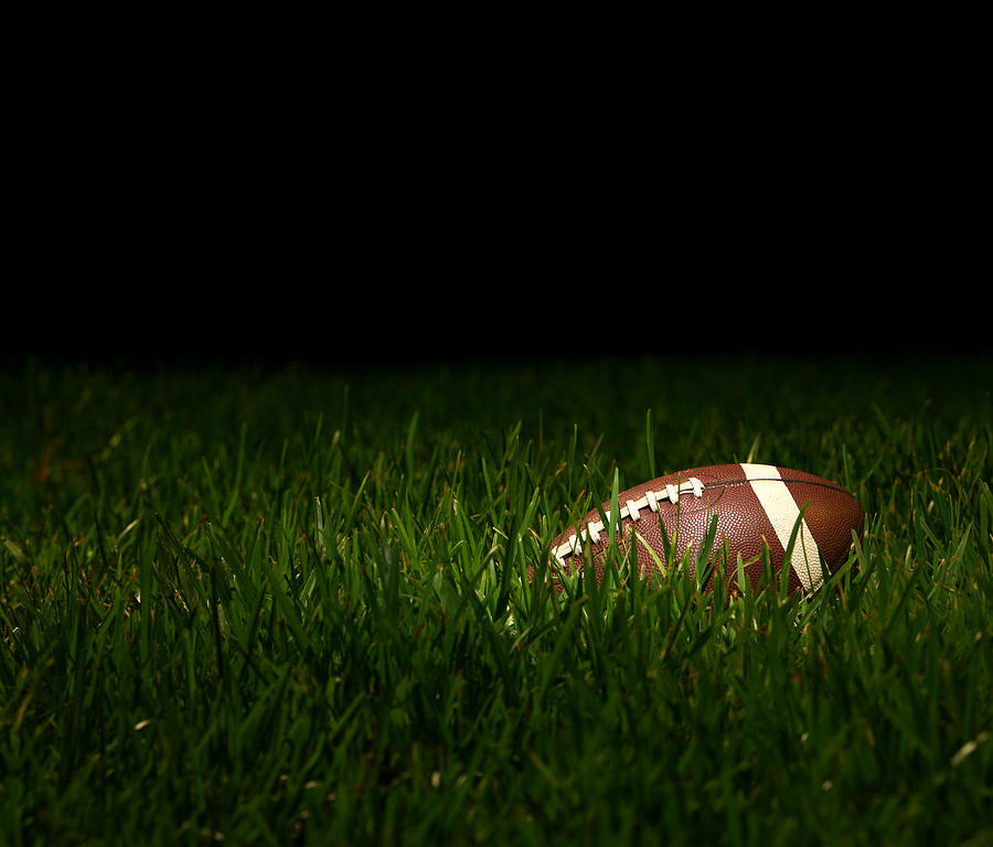Football Overgrown With Grass Photograph by Spxchrome
