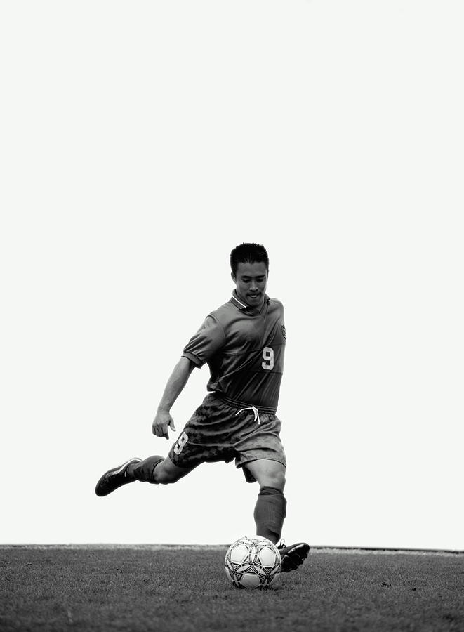 Football Player About To Kick Ball Photograph by Mike Powell Football Player About To Kick Ball Photograph by Mike Powell