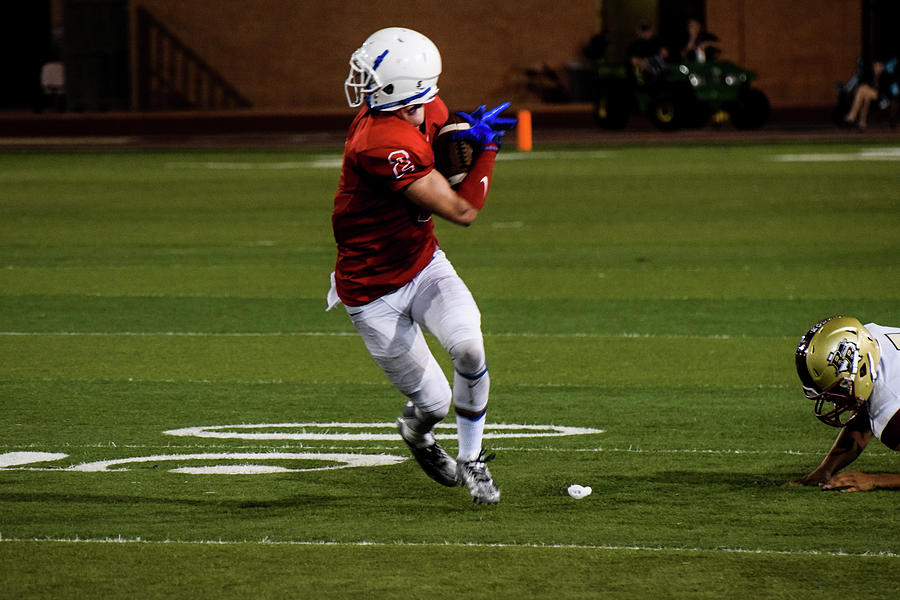 Football Player with Helmet on Backwards Photograph by Edward Garey