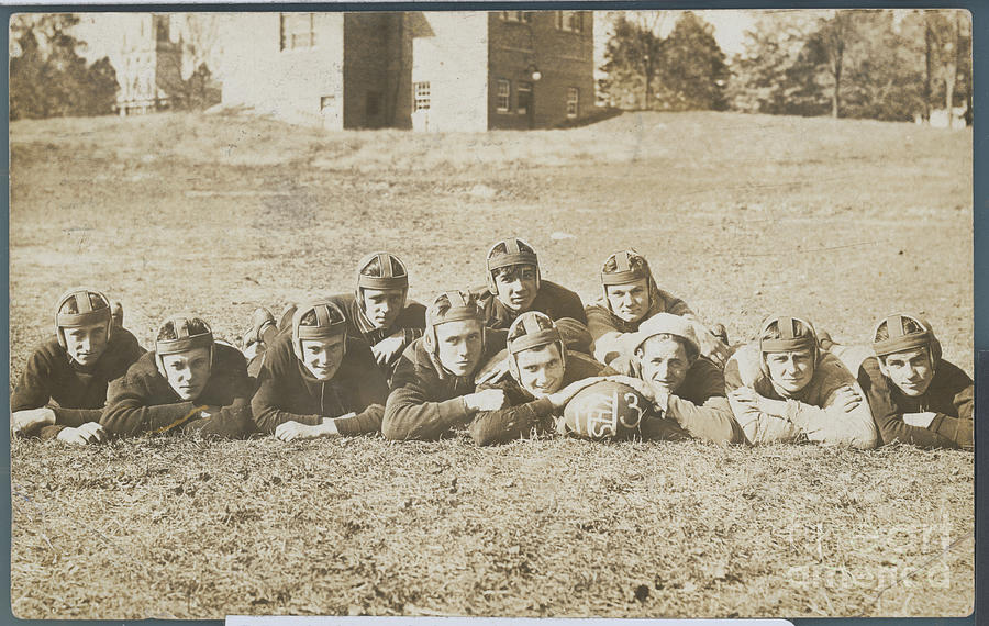 Football Team Posing On Grass Photograph by Bettmann