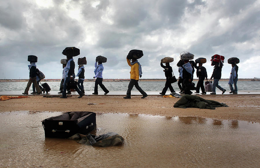 Beach Photograph - Foreign Workers Remain Stranded In Libya by John Moore