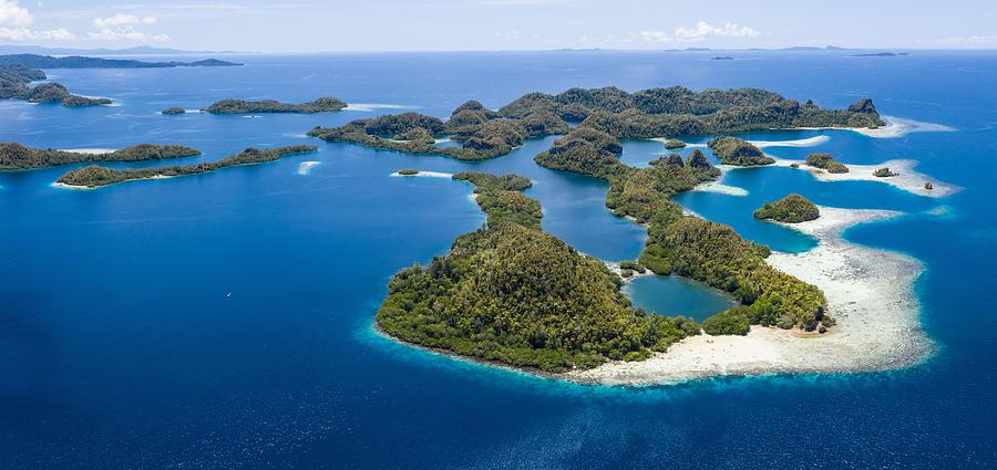 Nature Photograph - Forest-covered Limestone Islands Rise by Ethan Daniels
