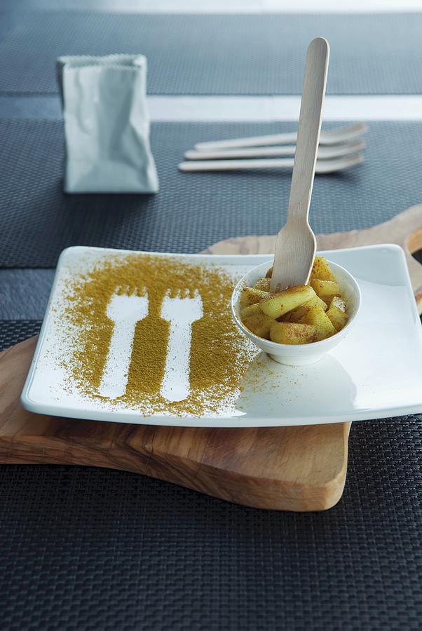 Fork Prints In Curry Powder On A Plate With A Bowl Of Curried Potatoes Photograph by Matteo Manduzio