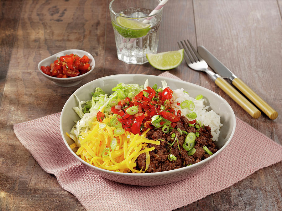 Forkable Beef Bowl With Rice, Tomatoes And Cheddar Cheese Photograph by Photoart / Stockfood Studios