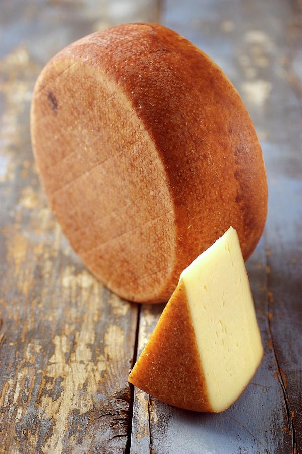 Formaggio Dolomiti cheese From Veneto, Italy Photograph by Franco Pizzochero