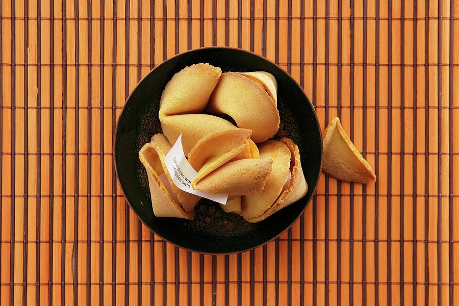 Fortune Cookies In A Bowl On A Bamboo Mat Photograph by Petr Gross