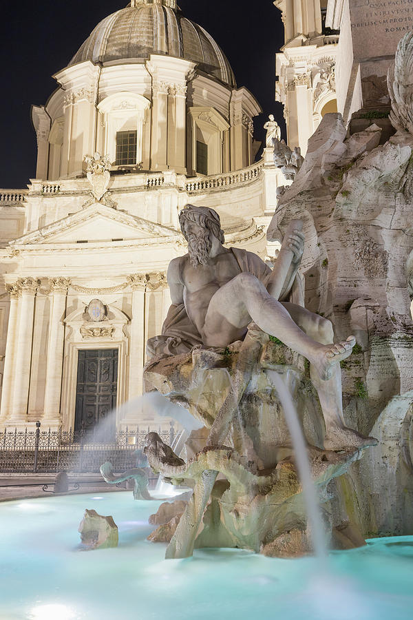 Fountain of the Four Rivers on Navona Square in Rome in the nigh