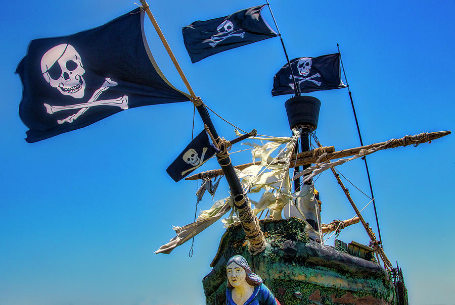 Four Black Flags On Pirate Ship Photograph by Garry Gay