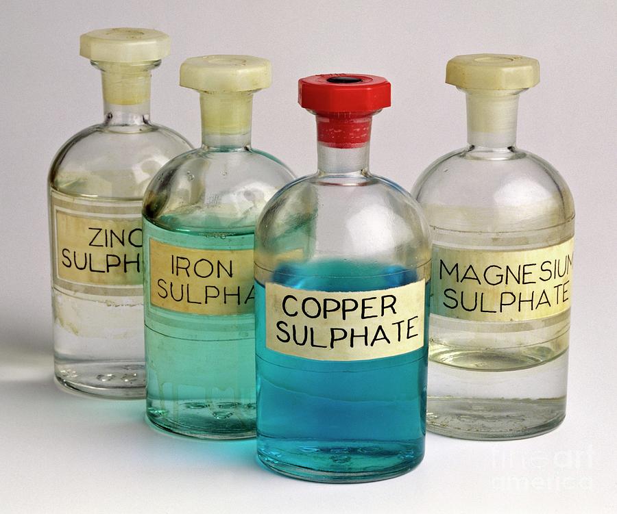 Four Bottles Of Sulphate Solutions Photograph by Martyn F. Chillmaid/science Photo Library