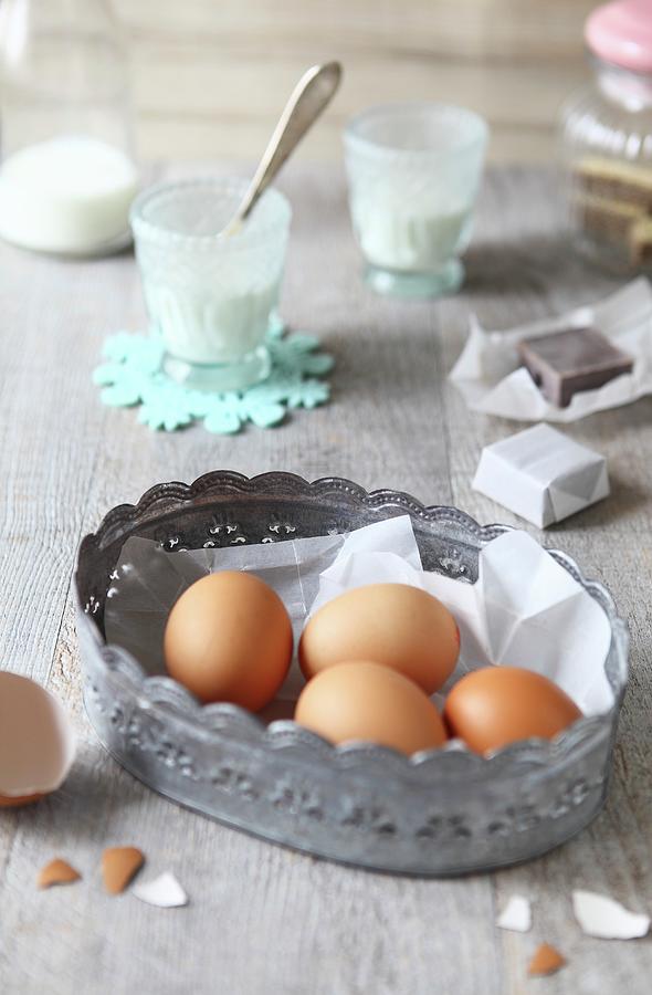 Four Brown Eggs In A Metal Basket On A Wooden Surface With Various Baking Ingredients Photograph by Sabrina Sue Daniels