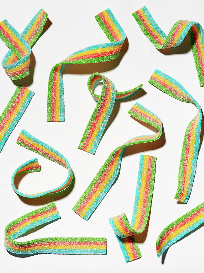 Four-colored Fruit Gum Strips On A White Background Photograph by Janellephoto