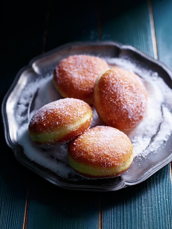Four Jam Doughnuts On A Pewter Plate Photograph by Oliver Brachat