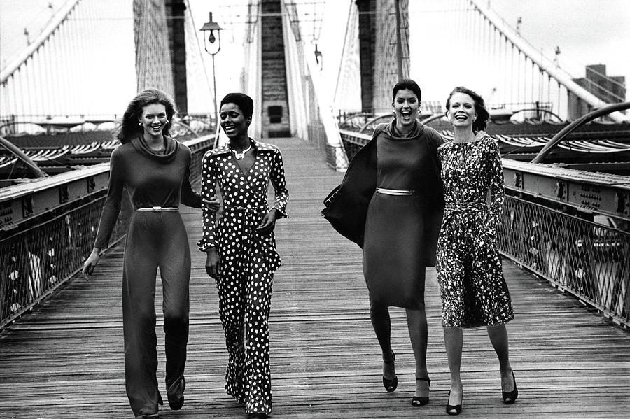 Four Models On A Bridge Wearing Diane Von Photograph by Mike Reinhardt