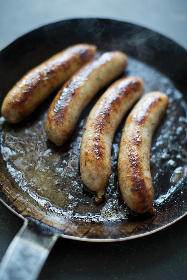 Four Sausages In A Pan Photograph by Jalag / Joerg Lehmann | Fine Art ...