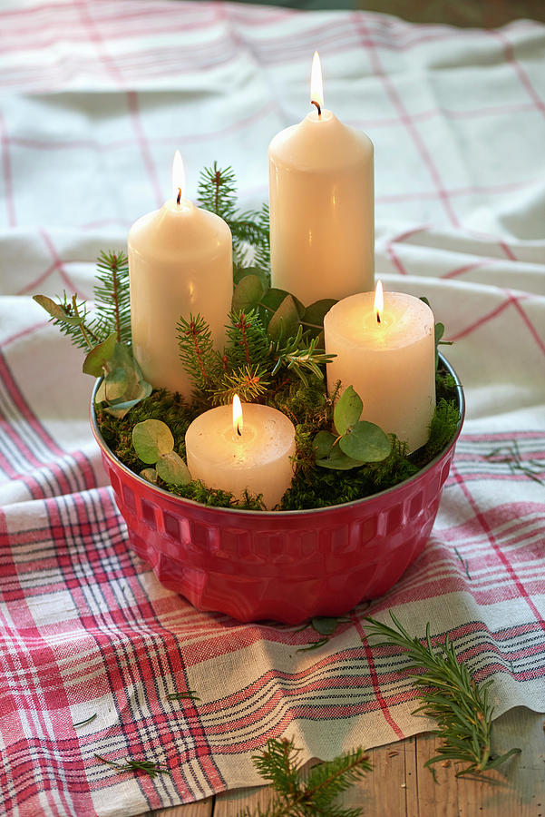 Four White Candles And Leafy Twigs In Bundt-cake Tin Photograph by Inge Ofenstein