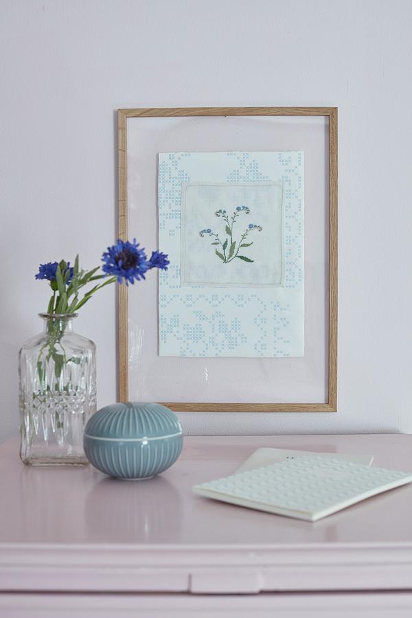 Framed Embroidered Floral Motif And Vase Of Cornflowers Photograph by Martin Slyst