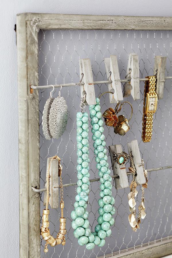 Framed Jewellery Rack With Clothes Pegs Photograph by Franziska Taube