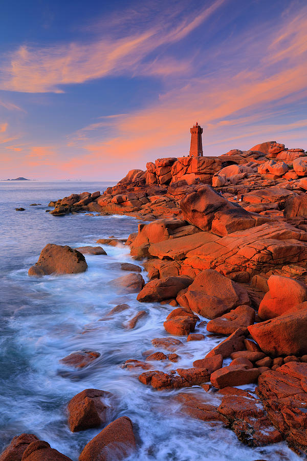 France, Brittany, Atlantic Ocean, English Channel, Cotes-darmor, Cote De Granit Rose, Ploumanach, Pink Granite Coast, Mean Ruz Lighthouse And Rock Formations In The Late Afternoon Light Digital Art by Riccardo Spila