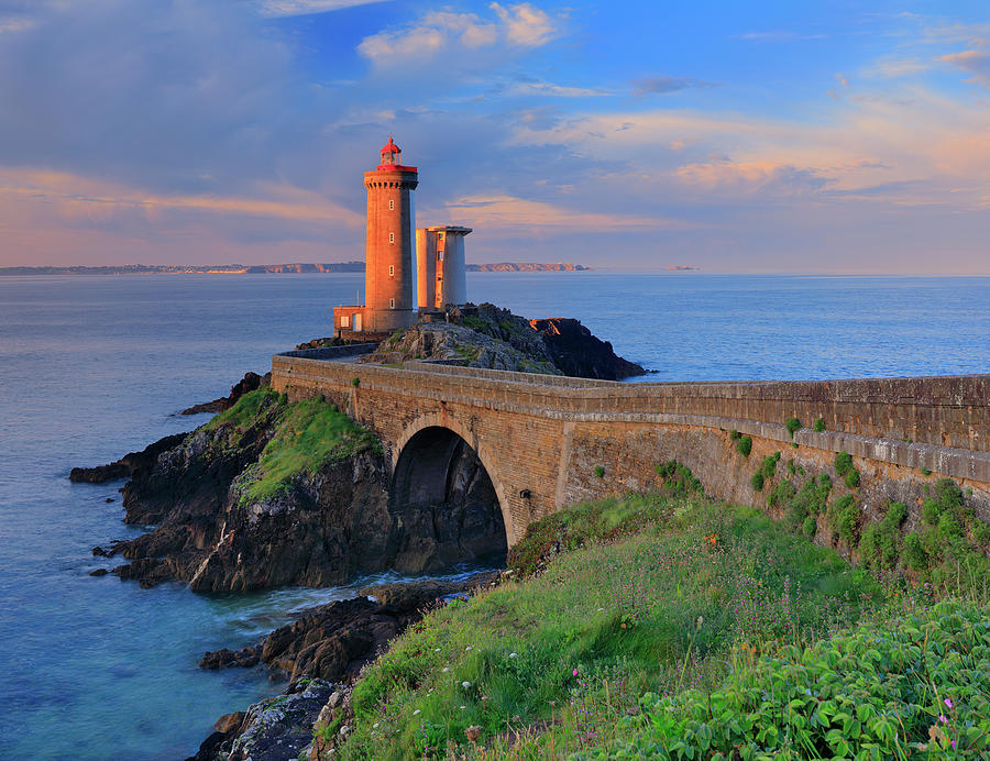 France, Brittany, Atlantic Ocean, Finistere, Plouzane, View Of Petit Minou Lighthouse, Located Along The Brest Harbor, In The Warm Light Of Sunrise Digital Art by Riccardo Spila