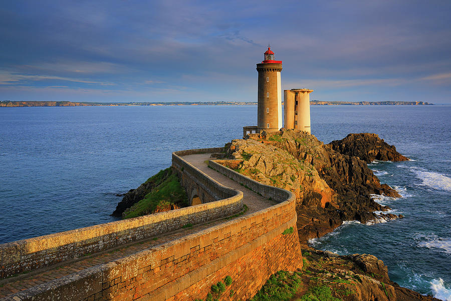 France, Brittany, Atlantic Ocean, Finistere, Plouzane, View Of Petit Minou Lighthouse, Located Along The Brest Harbor, In The Warm Light Of Sunset Digital Art by Riccardo Spila