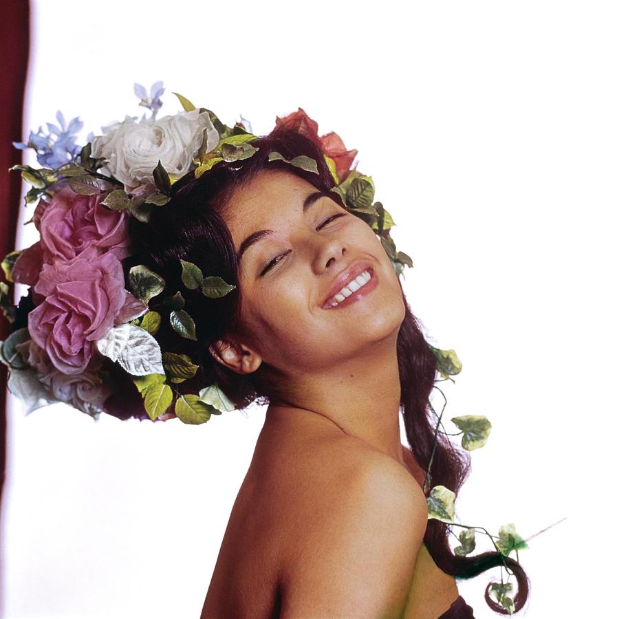 France Nuyen In A Flower Headdress Photograph by Bert Stern