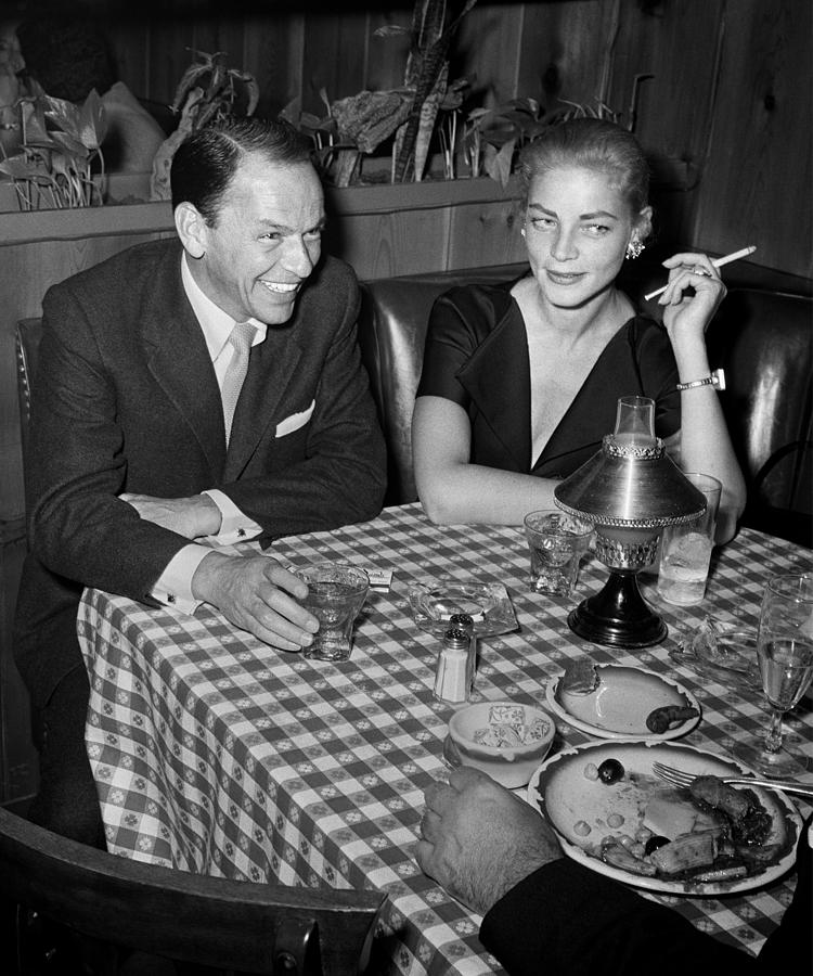 1957 Photograph - Frank Sinatra And Lauren Bacall At Cafe by Frank Worth