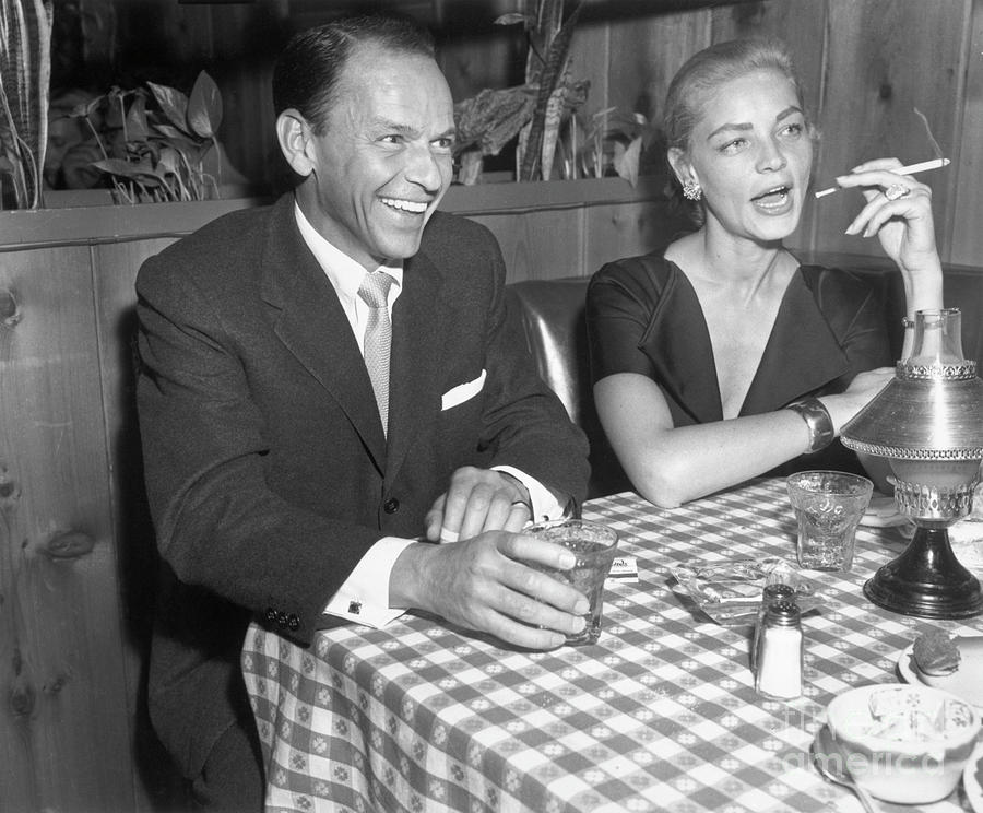 Frank Sinatra And Lauren Bacall Dining Photograph by Bettmann