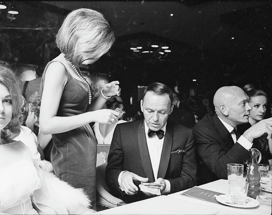Frank Sinatra lends his oldest daughter and first child Nancy Sandra wearing pearls, $50 for gambling money. Photograph by John Dominis