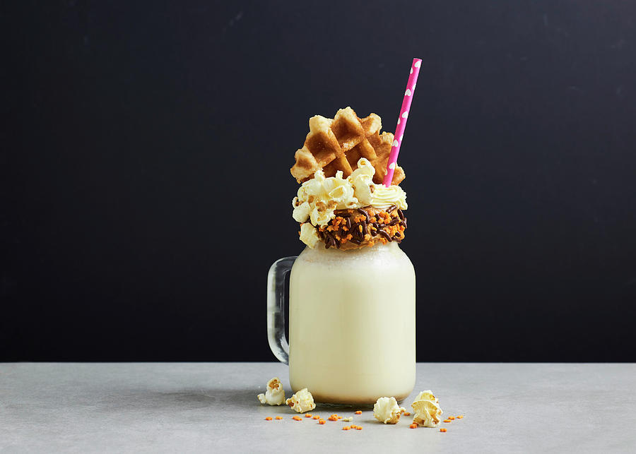 Freak Shake - Salted Caramel Milkshake With Popcorn And Waffle Black Background Photograph by Amanda Stockley