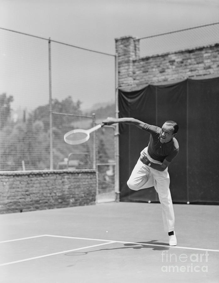 Fred Astaire Playing Tennis Photograph by Bettmann