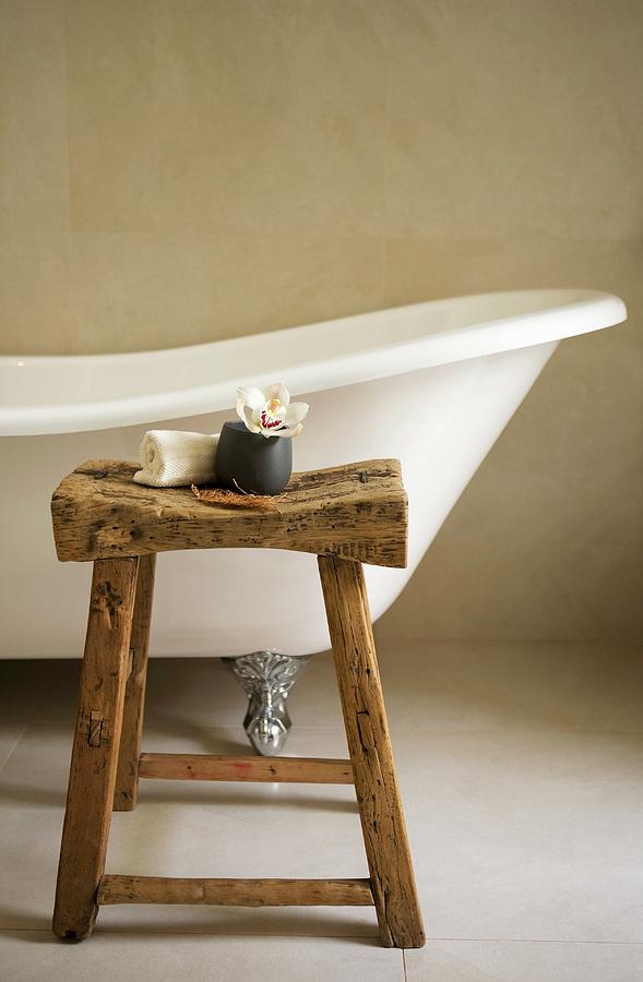 Free-standing, Antique Bathtub And Rustic Stool Photograph by Trudy Kelder