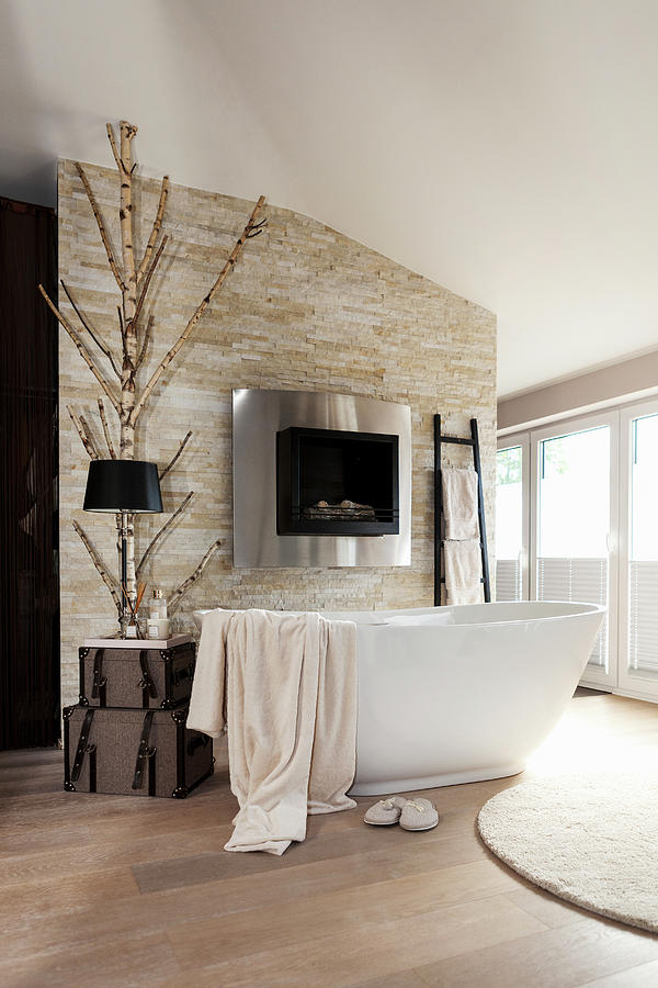 Free-standing Bathtub In Front Of Fireplace In Stone Wall Photograph by ...