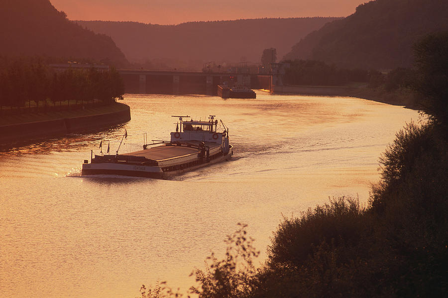 Freighter On The Rhine-main-danube Canal At Sunset, Lower Bavaria, Germany Photograph by Thomas Peter Widmann