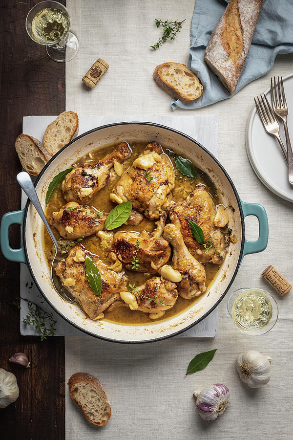 French Chicken In 40 Cloves Of Garlic, White Wine, Fresh Thyme And Bay Leave Photograph by Zuzanna Ploch