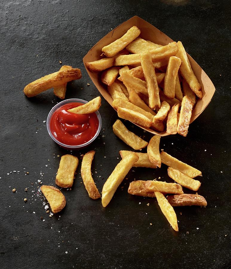 French Fries In A Cardboard Box With Ketchup Photograph by Ludger Rose