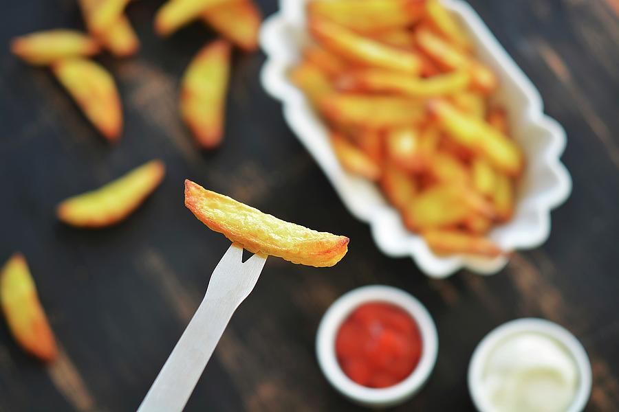 French Fries On A Fork And In A Bowl Photograph by Mariola Streim