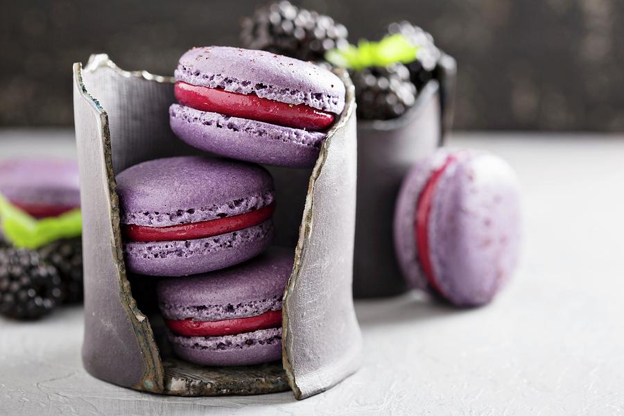 French Macarons With Berry Filling On A Gray Table Photograph by Elena Veselova