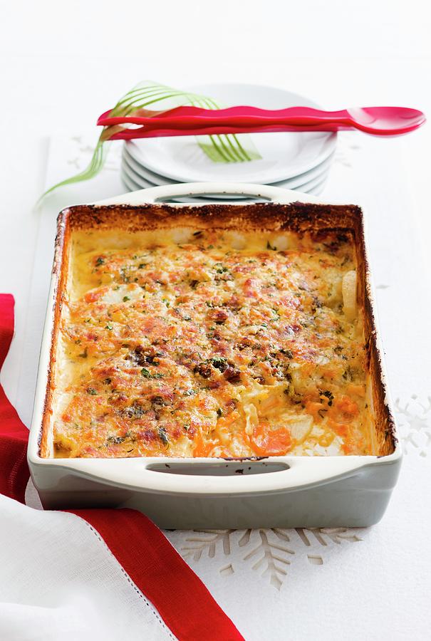 French Potato And Onion Bake As A Christmas Side Dish Photograph by Andrew Young