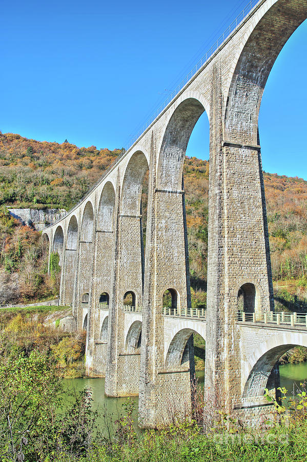 French stone viaduct bridge in Rhone-Alpes region in autumn season ...