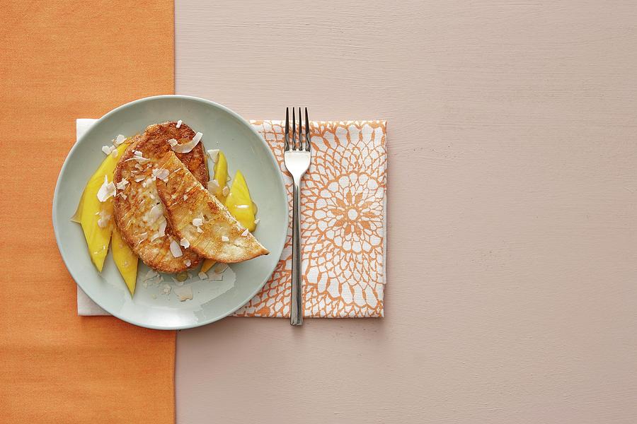 French Toast With Mango And Coconut Chips Photograph by Misha Vetter