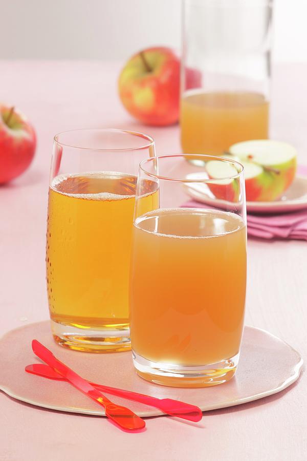 Fresh Apple Juice, Clear And Cloudy Photograph by Bender, Uwe