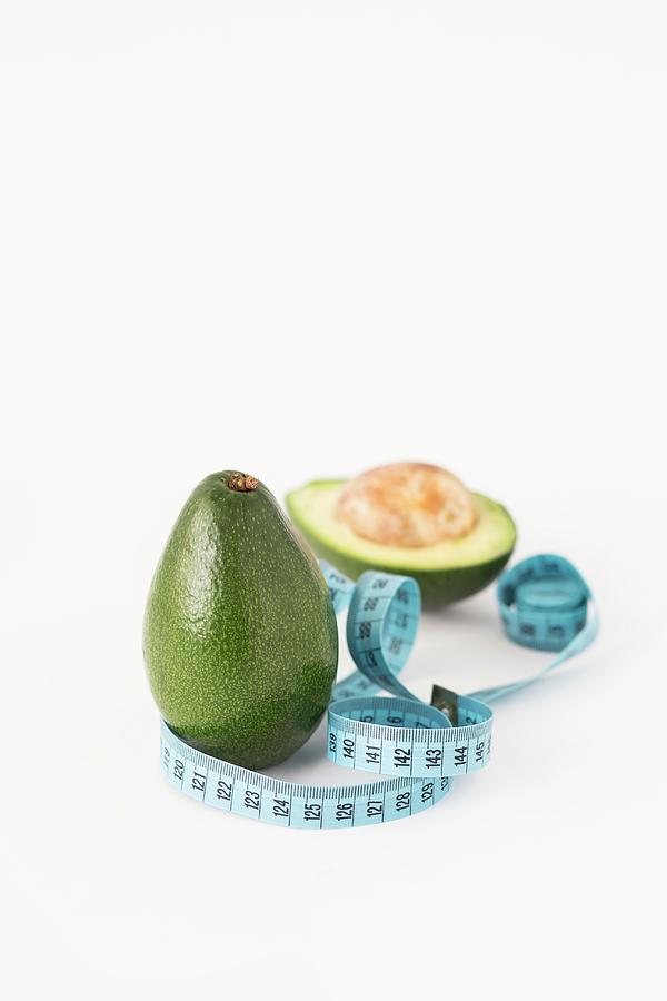 Fresh Avocados With A Measuring Tape Photograph by Malgorzata Laniak