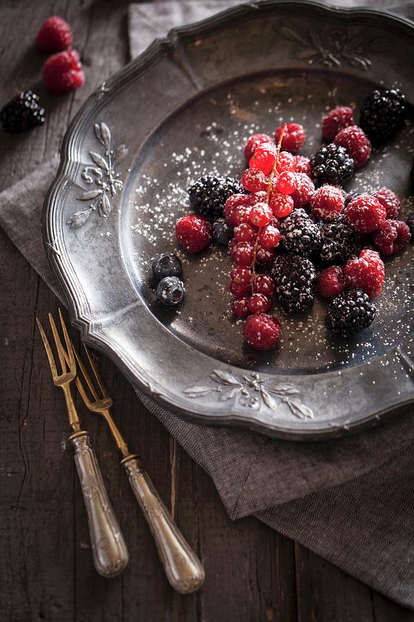 Fresh Berries With Sugar On A Pewter Plate Photograph by Malgorzata Stepien