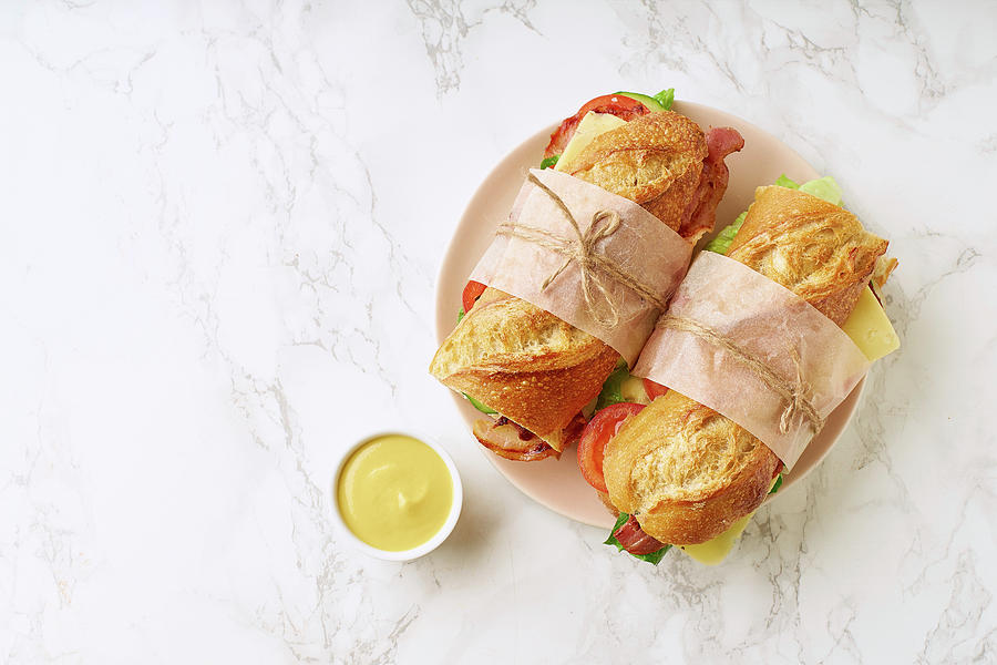 Fresh Big Baguette Sandwiches With Bacon, Chedder Cheese, Mustard, Lettuce And Vegetables Photograph by Asya Nurullina