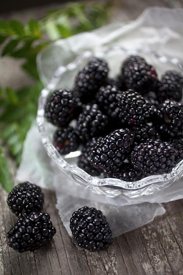Fresh Blackberries In And Beside A Glass Bowl Photograph by Stepien, Malgorzata