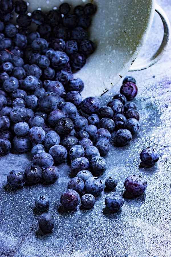 Fresh Blueberries Falling From A Metal Sieve Photograph by Charlotte Von Elm