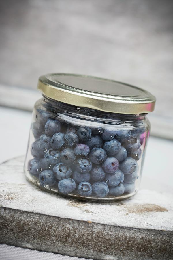 Fresh Blueberries In A Screw-top Jar Photograph by Esther Hildebrandt