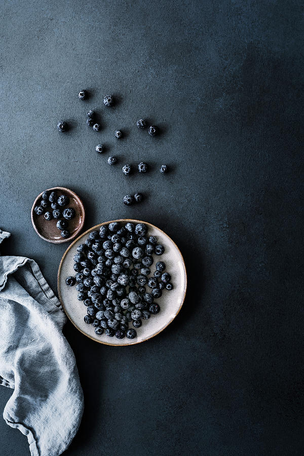 Fresh Blueberries On Plates In Front Of A Dark Background Photograph by Silvia Palma Photography