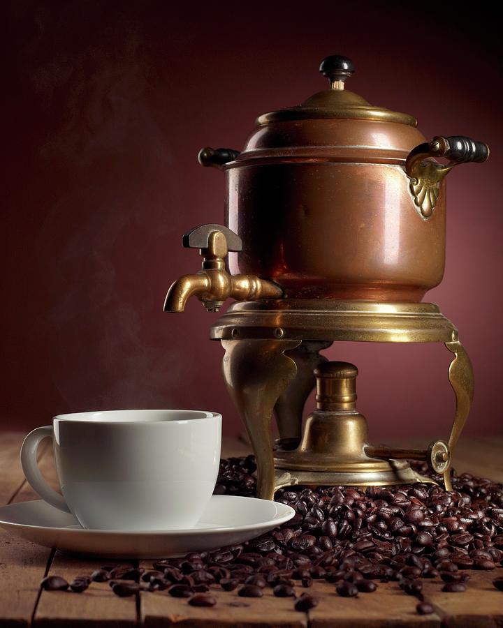 Fresh Brewed Coffee In A Cup With Coffee Beans And An Antique Brass Percolator Photograph by Harrison, Michael S.